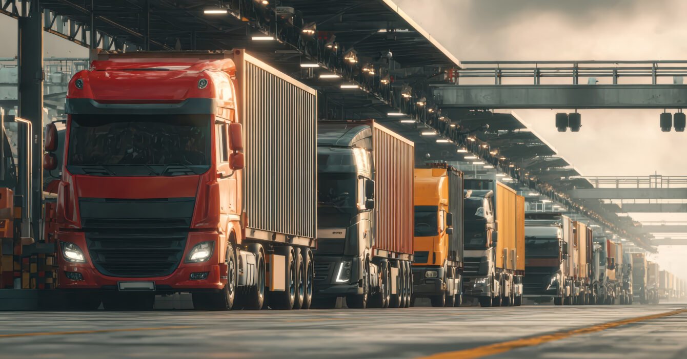 long-line-semi-trucks-industrial-loading-dock-Picsart-AiImageEnhancer
